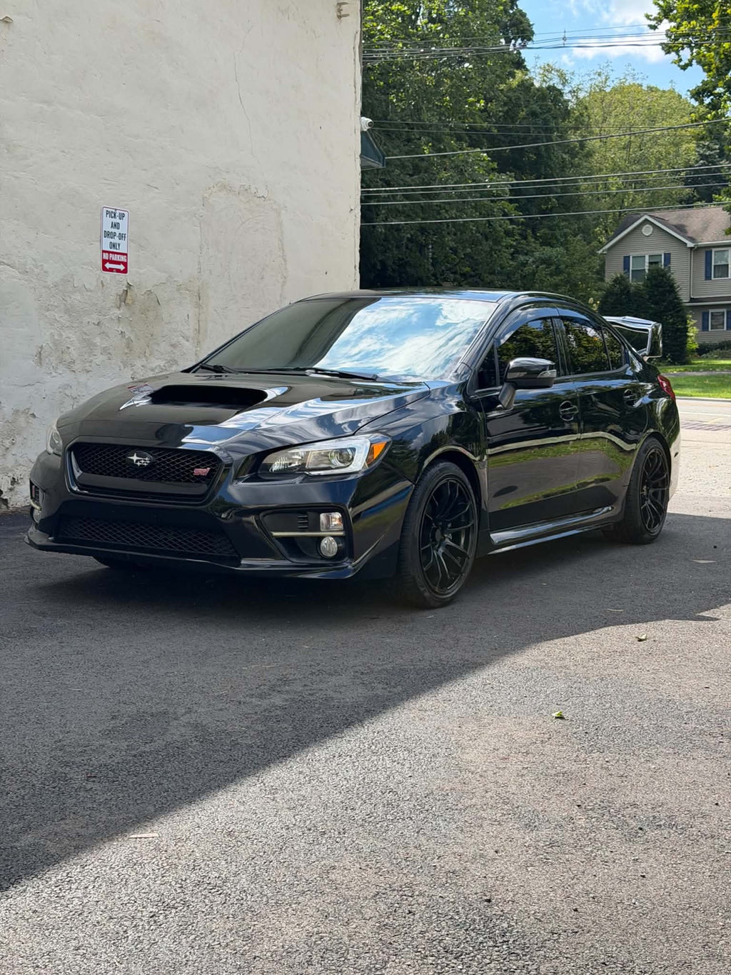 2016 Subaru WRX STI front three-quarter view in black, for sale
