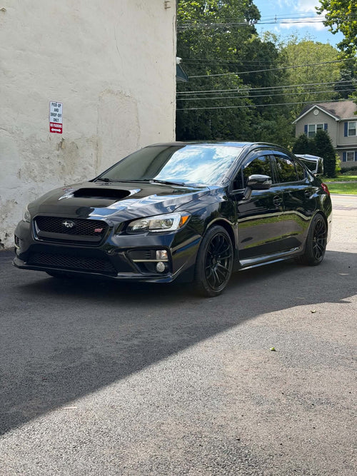 2016 Subaru WRX STI front three-quarter view in black, for sale
