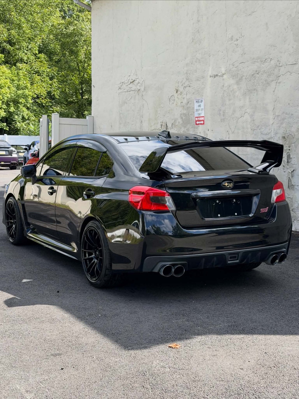 2016 Subaru WRX STI rear three-quarter view with GT wing, for sale