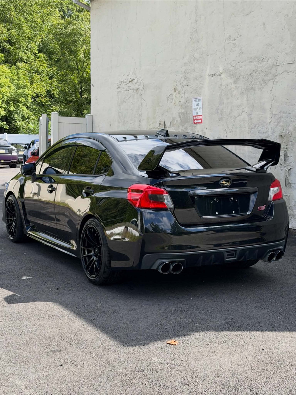 2016 Subaru WRX STI rear three-quarter view with GT wing, for sale