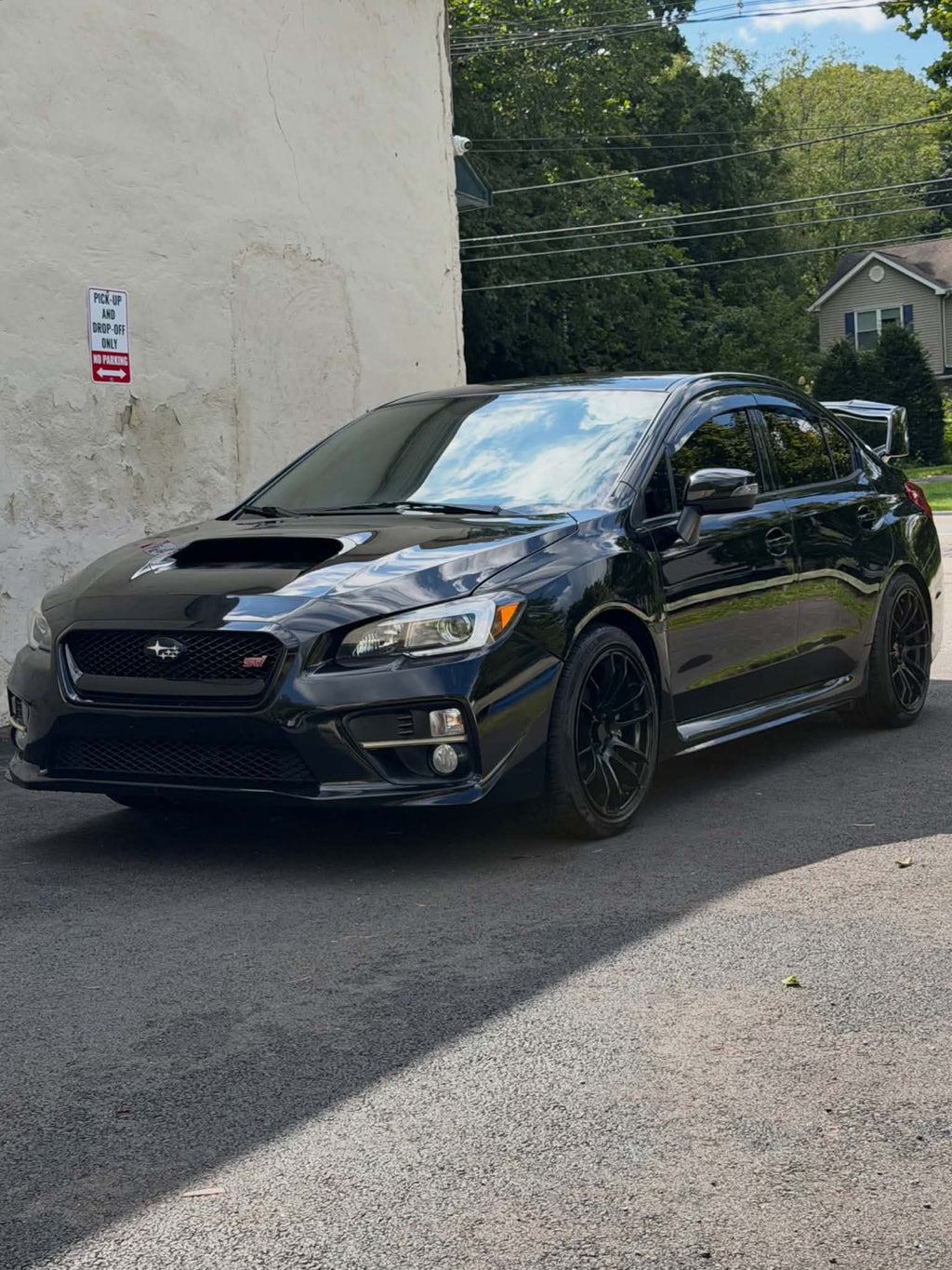 2016 Subaru WRX STI front three-quarter view in black, for sale