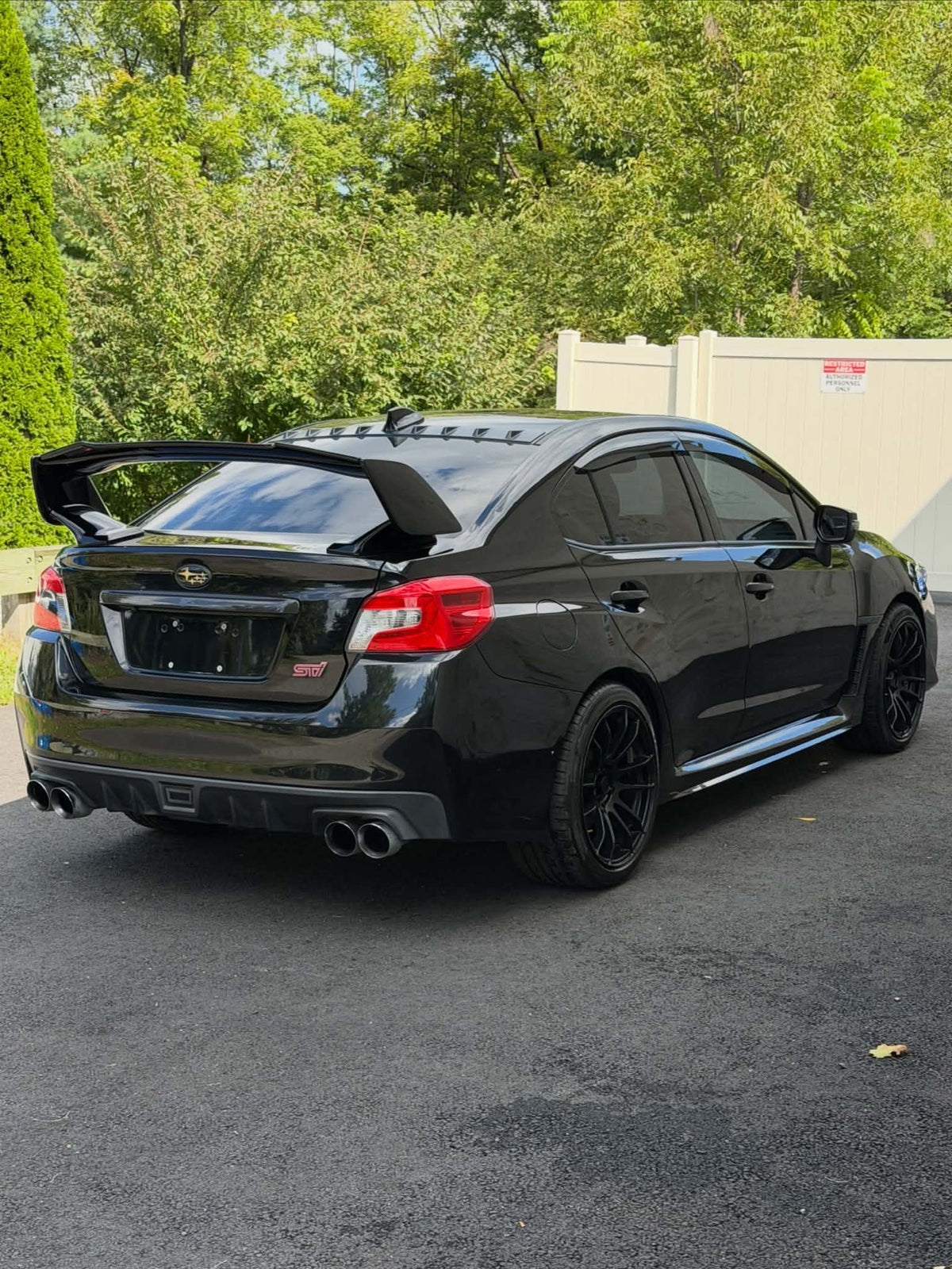 2016 Subaru WRX STI rear three-quarter view with GT wing, for sale